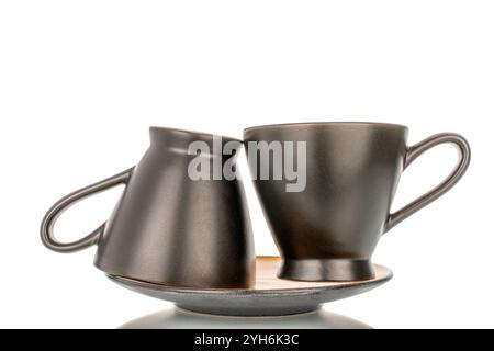 Two ceramic cups and saucers, macro, isolated on white background. Stock Photo