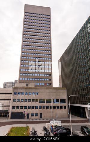 Rotterdam, NL - OCT 10, 2021: Street view and modern architecture with business towers in downtown Rotterdam. Rotterdam is the second largest city of Stock Photo