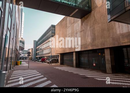 Rotterdam, NL - OCT 10, 2021: Street view and modern architecture with business towers in downtown Rotterdam. Rotterdam is the second largest city of Stock Photo