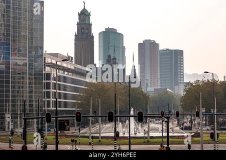 Rotterdam, NL - OCT 10, 2021: Street view and modern architecture with business towers in downtown Rotterdam. Rotterdam is the second largest city of Stock Photo