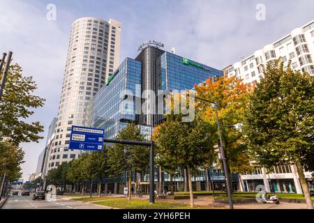 Rotterdam, NL - OCT 10, 2021: Street view and modern architecture with business towers in downtown Rotterdam. Rotterdam is the second largest city of Stock Photo