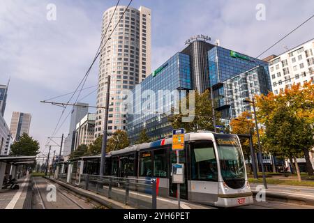 Rotterdam, NL - OCT 10, 2021: Street view and modern architecture with business towers in downtown Rotterdam. Rotterdam is the second largest city of Stock Photo