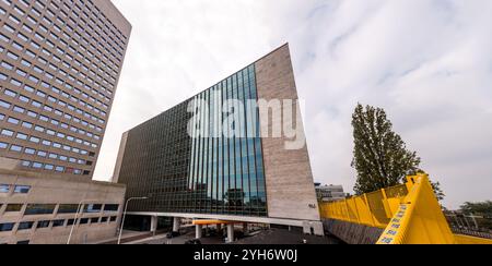 Rotterdam, NL - OCT 10, 2021: Street view and modern architecture with business towers in downtown Rotterdam. Rotterdam is the second largest city of Stock Photo