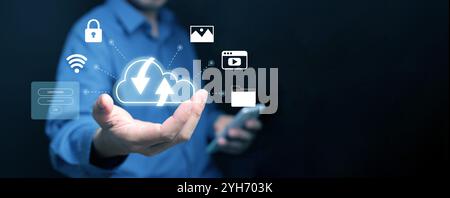 Cloud computing concept. A man with cloud computing service enables him to access photos, videos, and files safely over the internet Stock Photo