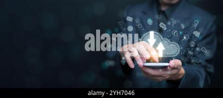 Cloud computing concept. A businessman using cloud computing service through a smartphone to enable access to files and other resources safely over th Stock Photo