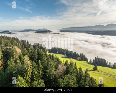 Aerial  landscape photo  above the low level clouds on a fall morning in the Bregenz Forest Mountains, Vorarlberg, Austria Stock Photo