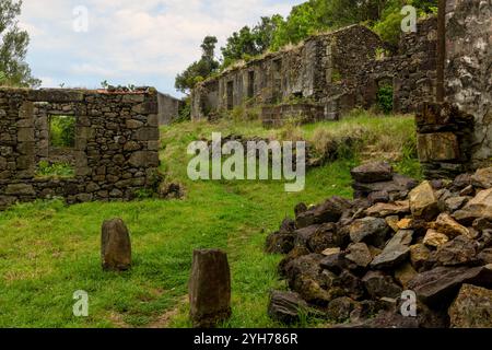 Caldeira do Mosteiro is an abandoned hamlet inside a volcanic crater, composed of 10 houses and a few barns in the parish of Mosteiro, Lajes das Flore Stock Photo