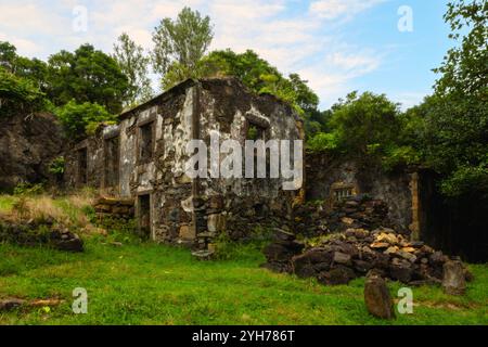 Caldeira do Mosteiro is an abandoned hamlet inside a volcanic crater, composed of 10 houses and a few barns in the parish of Mosteiro, Lajes das Flore Stock Photo