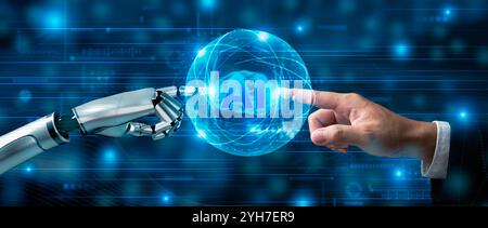 Human and robotic hand reaching out to touch AI hologram, symbolizing collaboration and innovation in artificial intelligence technology Stock Photo