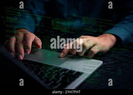 Hands typing on laptop with programming code on screen, representing software development. Perfect for coding, IT solutions, digital technology, web a Stock Photo