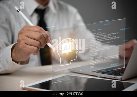 business professional using a digital pen to interact with an AI brain interface on a laptop, artificial intelligence creativity and coding program. T Stock Photo