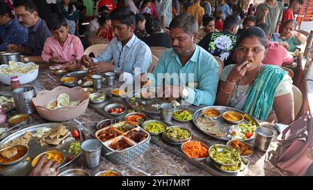 People eating thali in a food hotel in Chotila, Gujarat, India Stock Photo