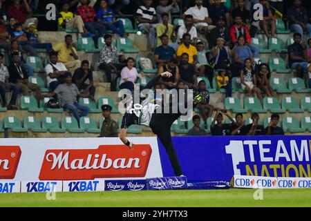 Dambulla, Sri Lanka. 9th Nov, 2024. New Zealand's Tim Robinson dives to stop the ball during the first Twenty20 International Cricket Match between Sri Lanka and New Zealand at the Rangiri Dambulla International Cricket Stadium in Dambulla, Sri Lanka, on Nov. 9, 2024. Credit: Ajith Perera/Xinhua/Alamy Live News Stock Photo