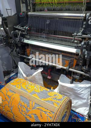 Mat weaving machine. Plastic mat making machine. Stock Photo