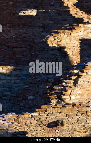 Light on the walls at Pueblo Bonito create an abstract photo in Chaco Culture National Historic Park, New Mexico. Stock Photo