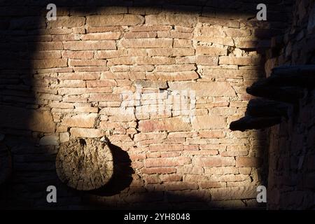 Light on the walls at Pueblo Bonito create an abstract photo in Chaco Culture National Historic Park, New Mexico. Stock Photo