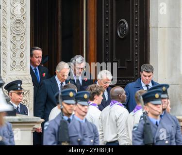 London, UK 10 November 2024. Former Prime Ministers emerge from the door of the Foreign, Commonwealth and Development Office in Whitehall to take their place at the Cenotaph, as the nation honours those who have lost their lives in conflicts on Remembrance Sunday. (Pictured from left to right - David Cameron, Tony Blair, Gordon Brown, John Major) Credit: MartinJPalmer/Alamy Live News Stock Photo