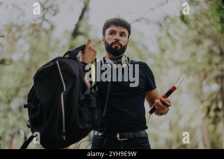 Young student engaging in outdoor study session with classmates Stock Photo