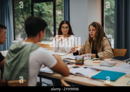 Group of students engaged in a collaborative study session Stock Photo