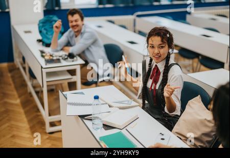 Engaged students interacting during a classroom lecture session Stock Photo