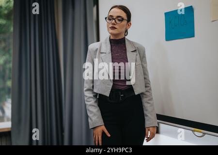 Confident teacher explaining chemistry concept in classroom setting Stock Photo