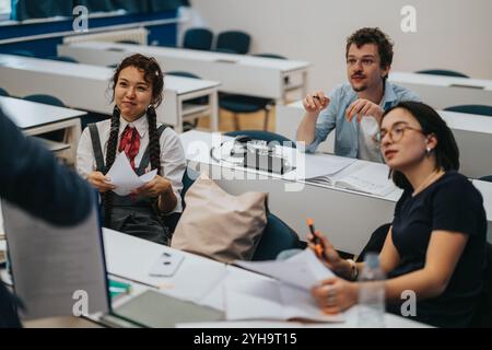 Students engaging in classroom activities with professor's guidance Stock Photo
