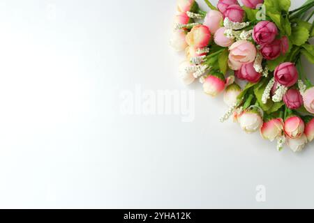White horizontal background with bunch of pink rosebuds in top right corner. Copy space available. Flower abstract background for wedding & valentine. Stock Photo