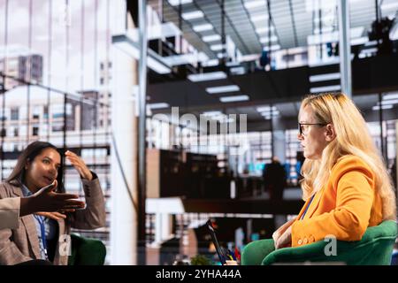 Confident group of women in a men dominated business environment strategizing to develop the company globally. Female empowerment, resilience and leadership driving corporate success. Stock Photo