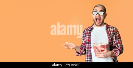 Scared guy in 3d glasses tossed popcorn Stock Photo