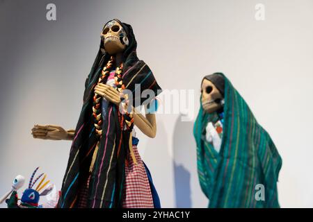 Sculptures “Catrina with Colored Bows” from Michoacán on display at an exhibition featuring art inspired by the traditions of Dia de los Muertos at th Stock Photo