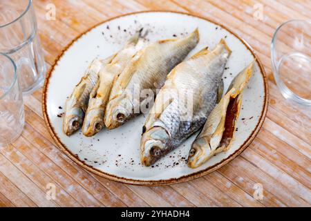 Dried roaches served on wooden table Stock Photo