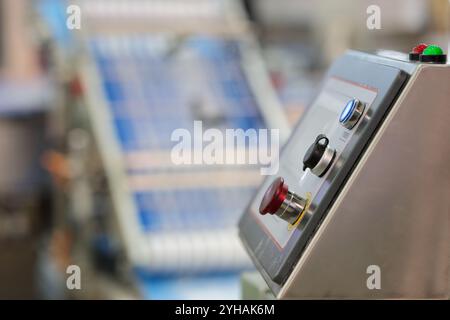 Control console with touchscreen closeup. Control console of modern automated manufacturing equipment in food processing industry. Selective focus. Stock Photo