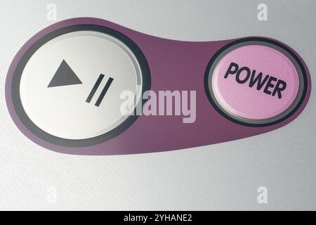 close-up view of control panel of power and start pause circular buttons on electronic appliance, modern and user friendly Stock Photo
