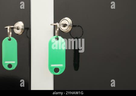 Modern lockers with bright keys, closeup view Stock Photo