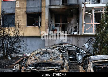 ODESA, UKRAINE - NOVEMBER 9, 2024 - Burned-down cars are seen outside a residential building damaged by a Russian drone attack, Odesa, southern Ukraine Stock Photo
