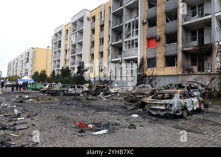 ODESA, UKRAINE - NOVEMBER 9, 2024 - Burned-down cars are seen outside a residential building damaged by a Russian drone attack, Odesa, southern Ukraine Stock Photo