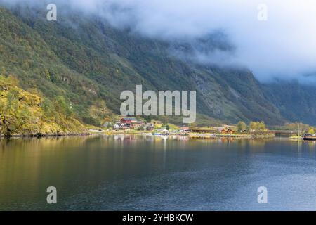 The village of Gudvangen a popular tourist destination sits on the shore of Naerofjord a Unesco world heritage area in western Norway Stock Photo