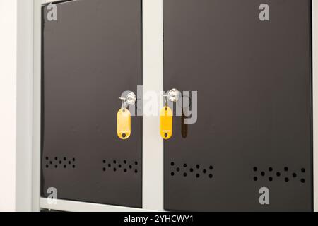 Modern lockers with bright keys, closeup view Stock Photo