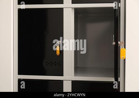 Modern lockers with bright keys indoors, closeup Stock Photo