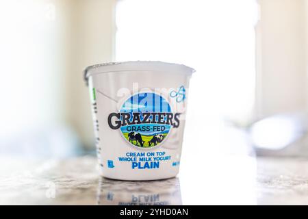 Avon, USA - August 31, 2022: Closeup macro of Graziers grass-fed yogurt container of cream on top plain whole milk yoghurt yogurt Stock Photo