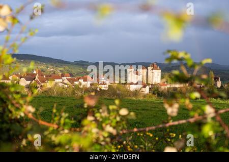 View over the medieval town of Curemonte after rain with a rainbow above, France Stock Photo