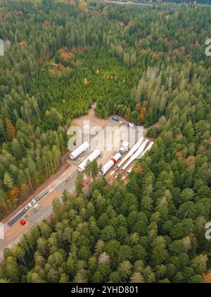 Aerial view of wind farm construction featuring a turbine tower, rotor ...