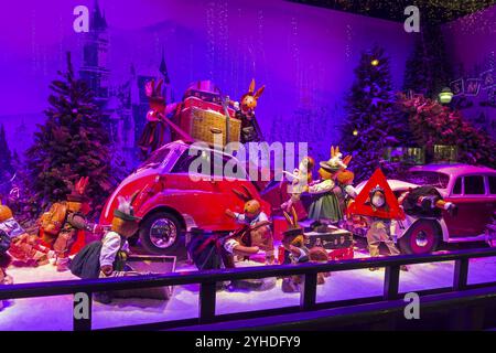 PARIS, FRANCE, DECEMBER 12, 2017: Christmas decorations in the shop window of a Parisian Printemps department store. A fabulous scene, hares in the na Stock Photo