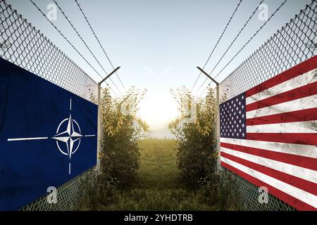 Bavaria, Germany - November 11, 2024: NATO and USA country flags on a fence at a border. Symbolic image of conflict, dispute and debate, symbolically depicted with US-American and NATO allies alliance flag and military mood in the border area as in war. PHOTOMONTAGE *** NATO und USA Länder-Fahnen auf einem Zaun an einer Grenze. Symbolbild für Konflikt, Streit und Debatten, symbolisch dargestellt mit US-Amerikanische und NATO Verbündete Bündnis Flagge und militärischer Stimmung im Grenzgebiet wie im Krieg. FOTOMONTAGE Stock Photo