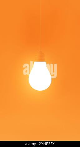 Minimalist image featuring a single glowing lightbulb suspended against a vibrant orange background. Ideal for themes of creativity, innovation, and b Stock Photo