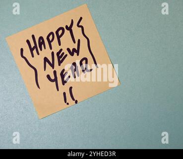 Yellow post it note with Happy New Year Stock Photo