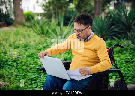 Man Wheelchair Working Learning On Laptop Stock Photo