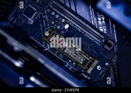 Lviv, Ukraine - October 30, 2024: Samsung SSD 990 PRO PCle 4.0 NVMe M.2 on motherboard background Stock Photo