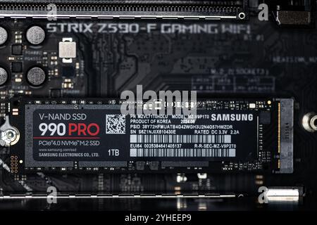 Lviv, Ukraine - October 30, 2024: Samsung SSD 990 PRO PCle 4.0 NVMe M.2 on motherboard background Stock Photo