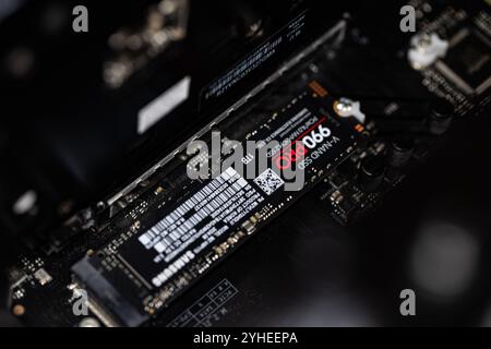 Lviv, Ukraine - October 30, 2024: Samsung SSD 990 PRO PCle 4.0 NVMe M.2 on motherboard background Stock Photo